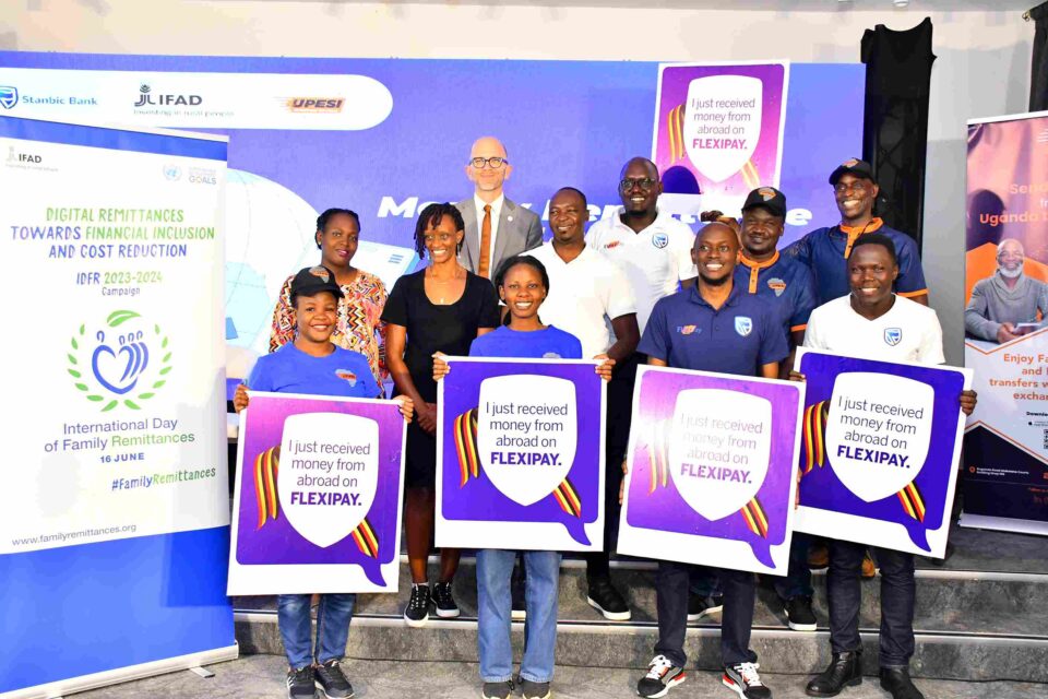 FlexiPay IFAD and Upesi Money Transfer Teams pose for a group photo after the launch at Amin Pasha Hotel in Kampala 11zon