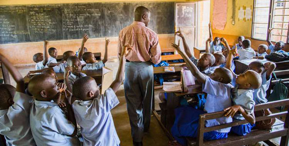 Children in class. Ugandan teachers will need o find legal documents to stay in Rwandan classes