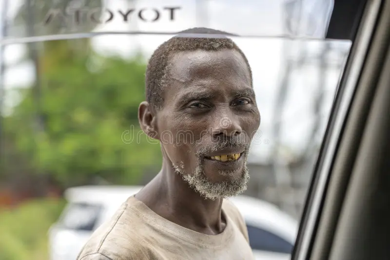 zanzibar tanzania december african poor man street passing car asks money food island east africa close up 195769791